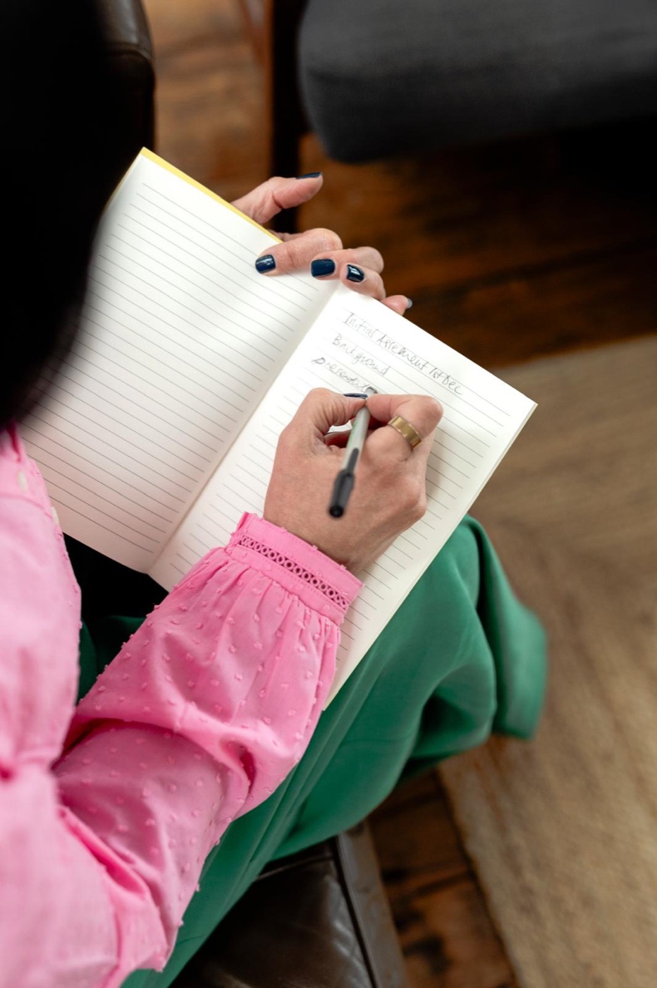 Writing an occupational formulation in a notebook